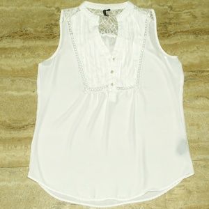 sleeveless white half button up blouse